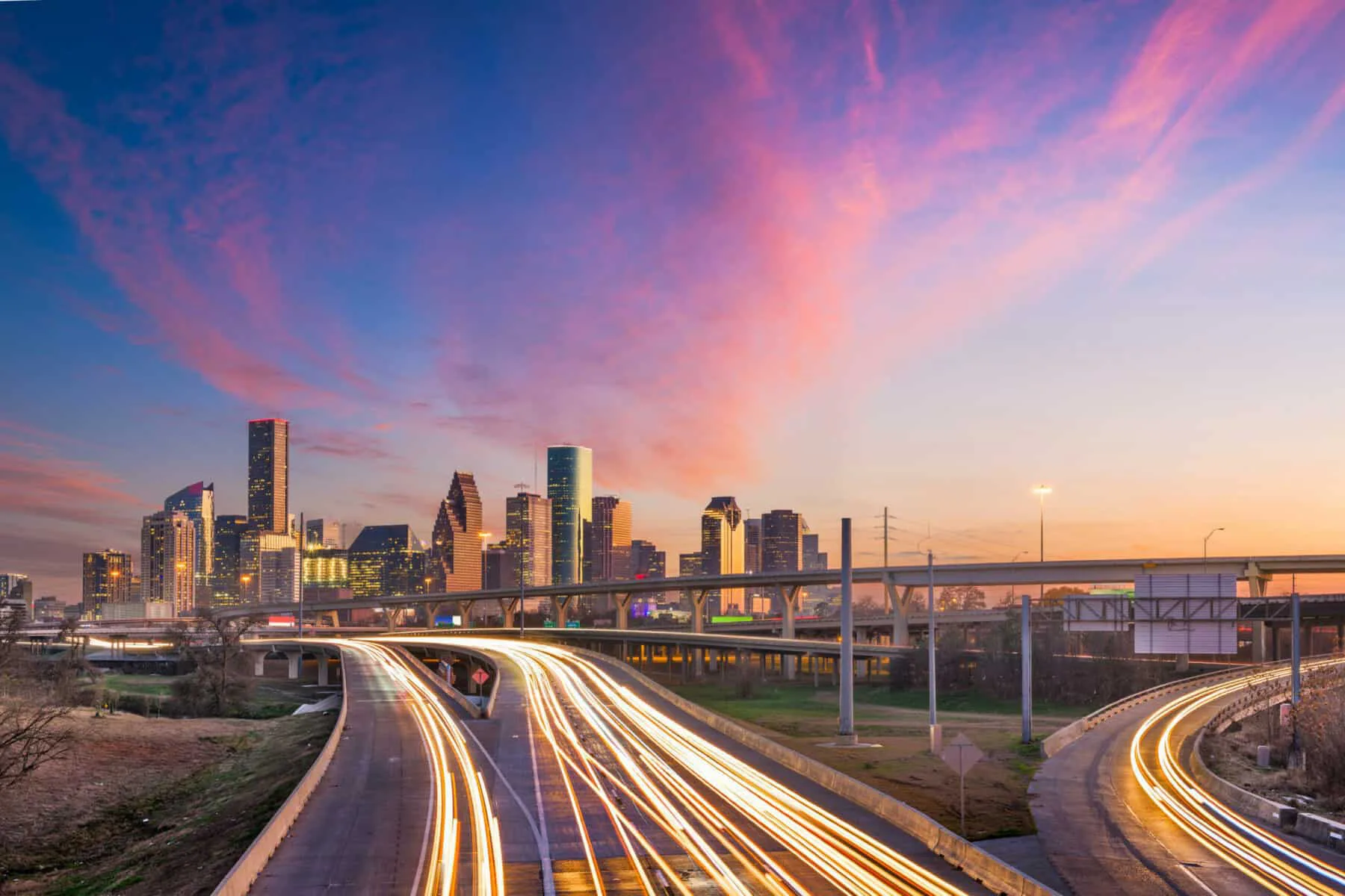 Houston, Texas, USA downtown skyline over the highways at dusk. | HDR Selected To Complete Final Design for Key Segments of Greater Houston’s Grand Parkway