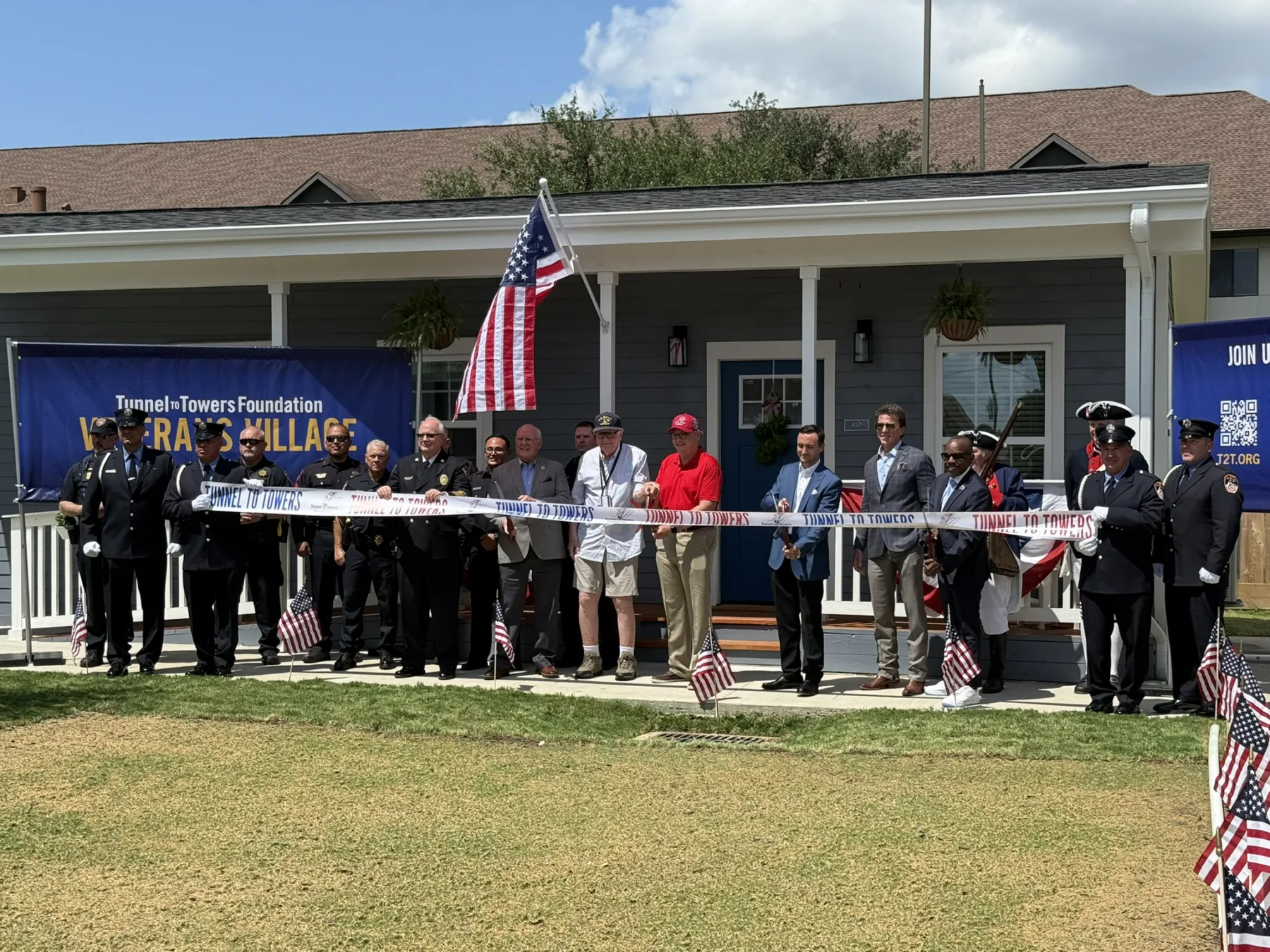 Ribbon-cutting Ceremony. Photo Credit: LAN. | Ribbon Cutting Celebrates Opening of Tunnel to Towers Smart Home Community for Veterans and First Responders 