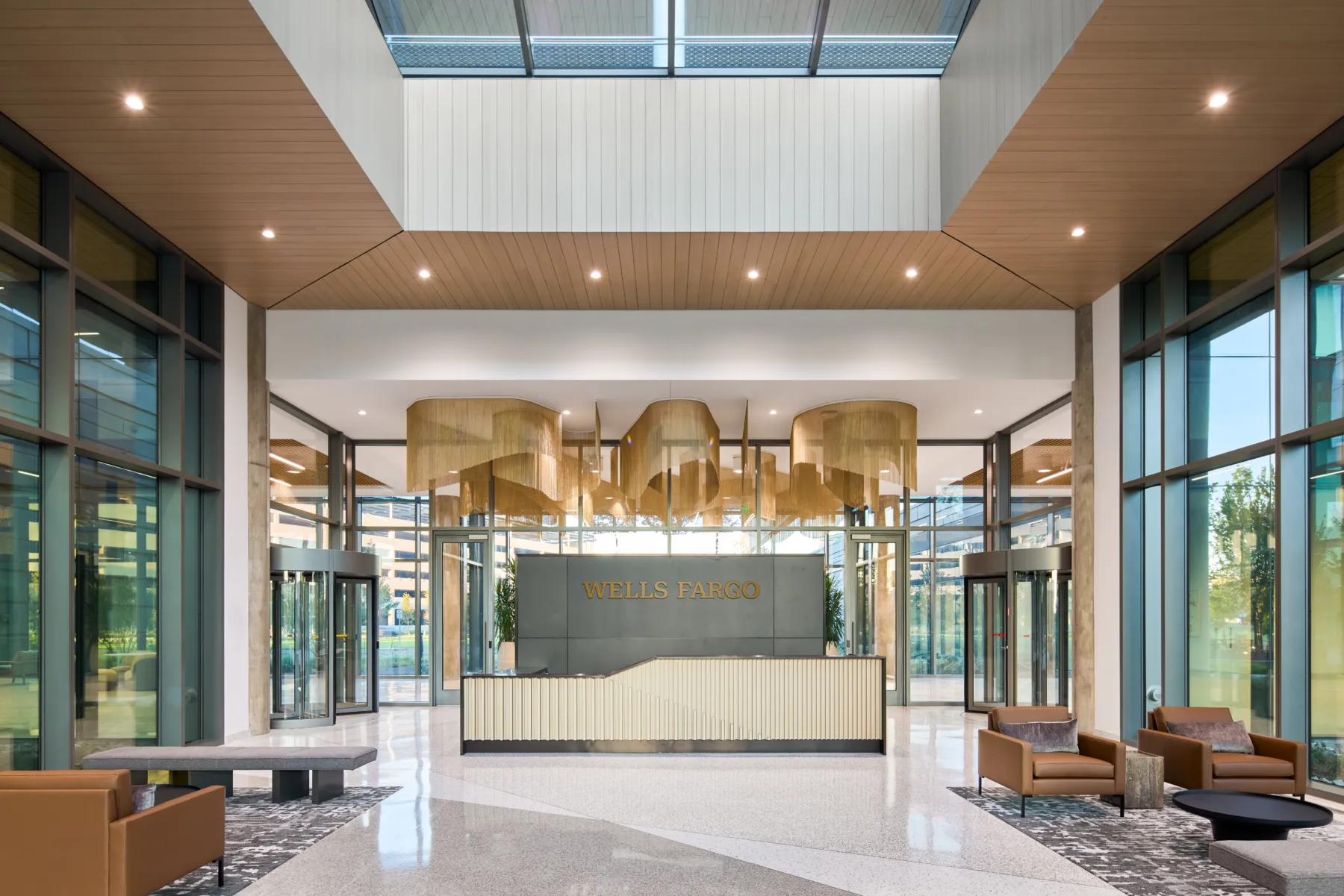 Grand entrance hall with sleek modular fruity and gold accents.