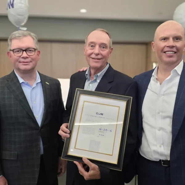 Left to right: President Steve Gilbreath, past president and award recipient Dennis Petersen, and CEO Ed Benes. Photo Credit: LAN. | LAN, Inc. Honors Dennis Petersen with 2026 Excellence Award 